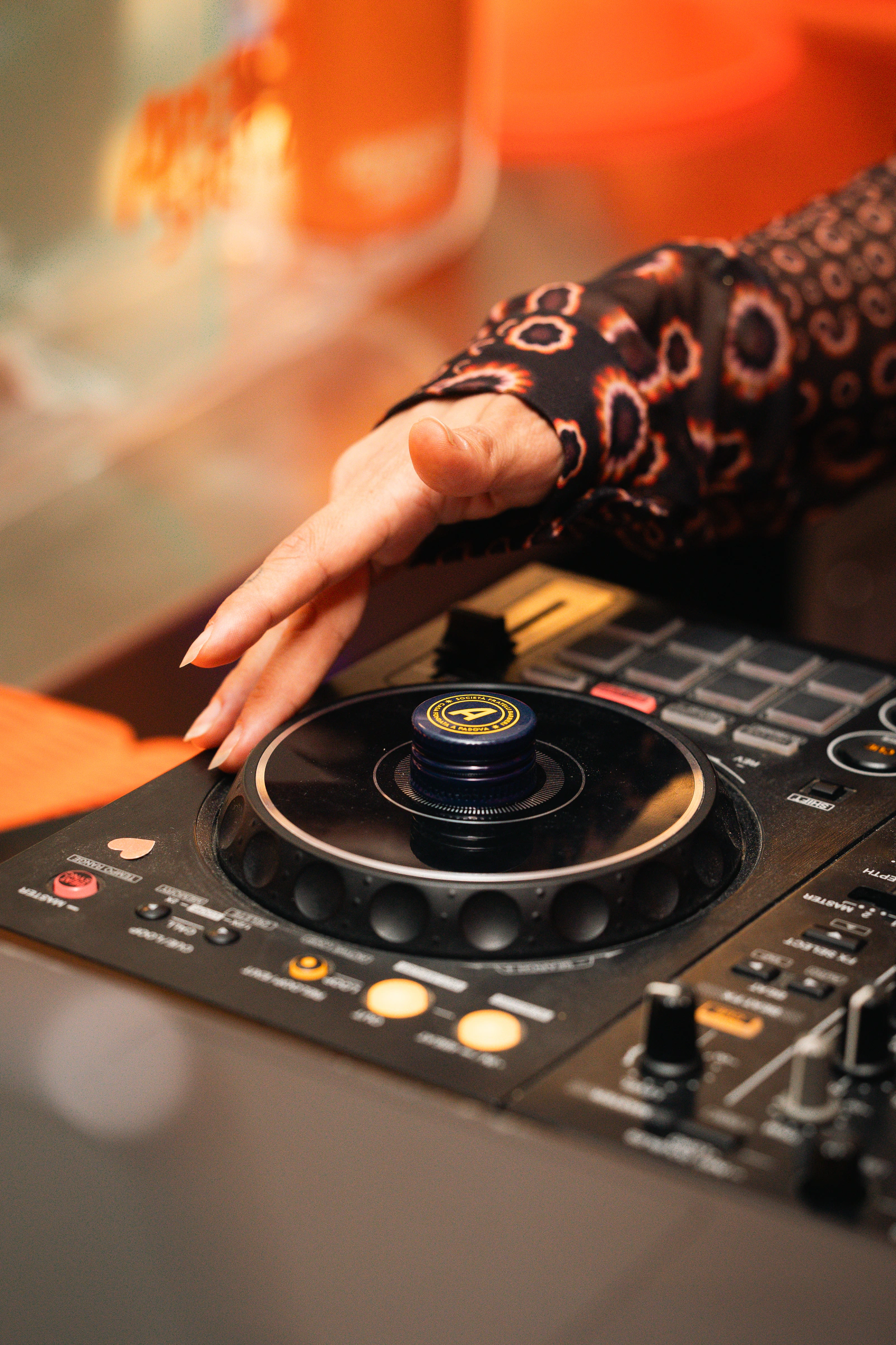 A hand working the DJ controller