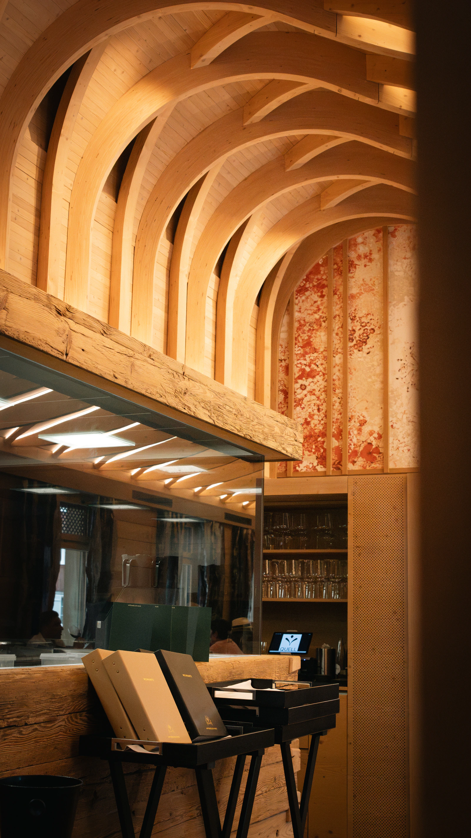 The vaulted corridor of the house, warmly lit