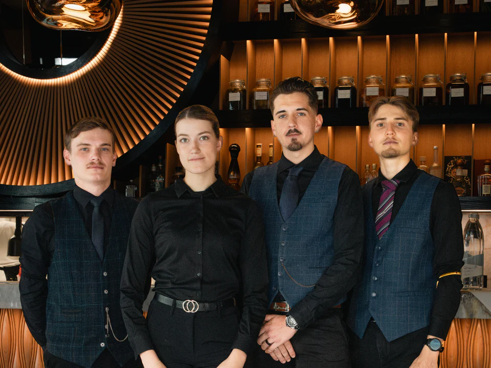 The front-of-house team lined up in the bar
