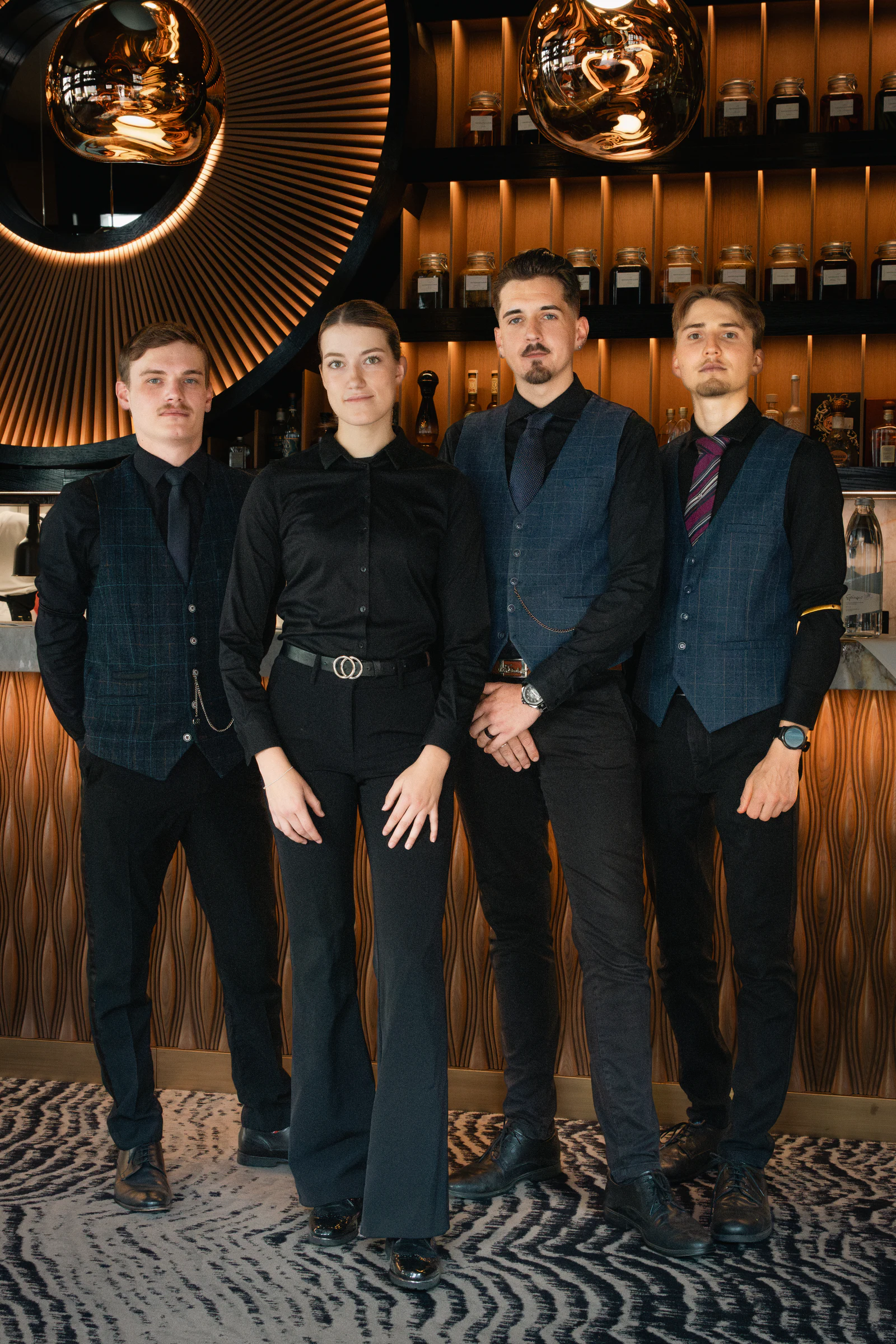 The front-of-house team lined up in the bar