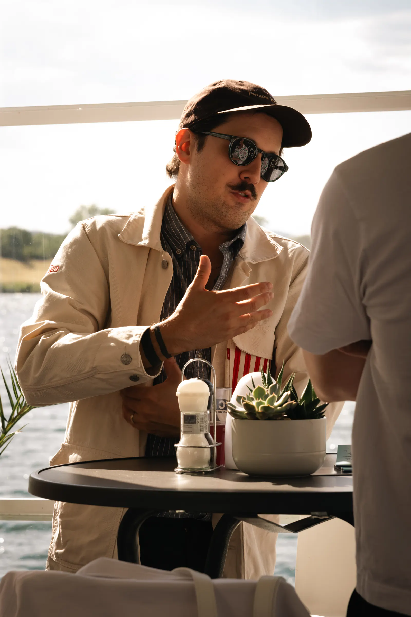 A guest at a table, mid-conversation