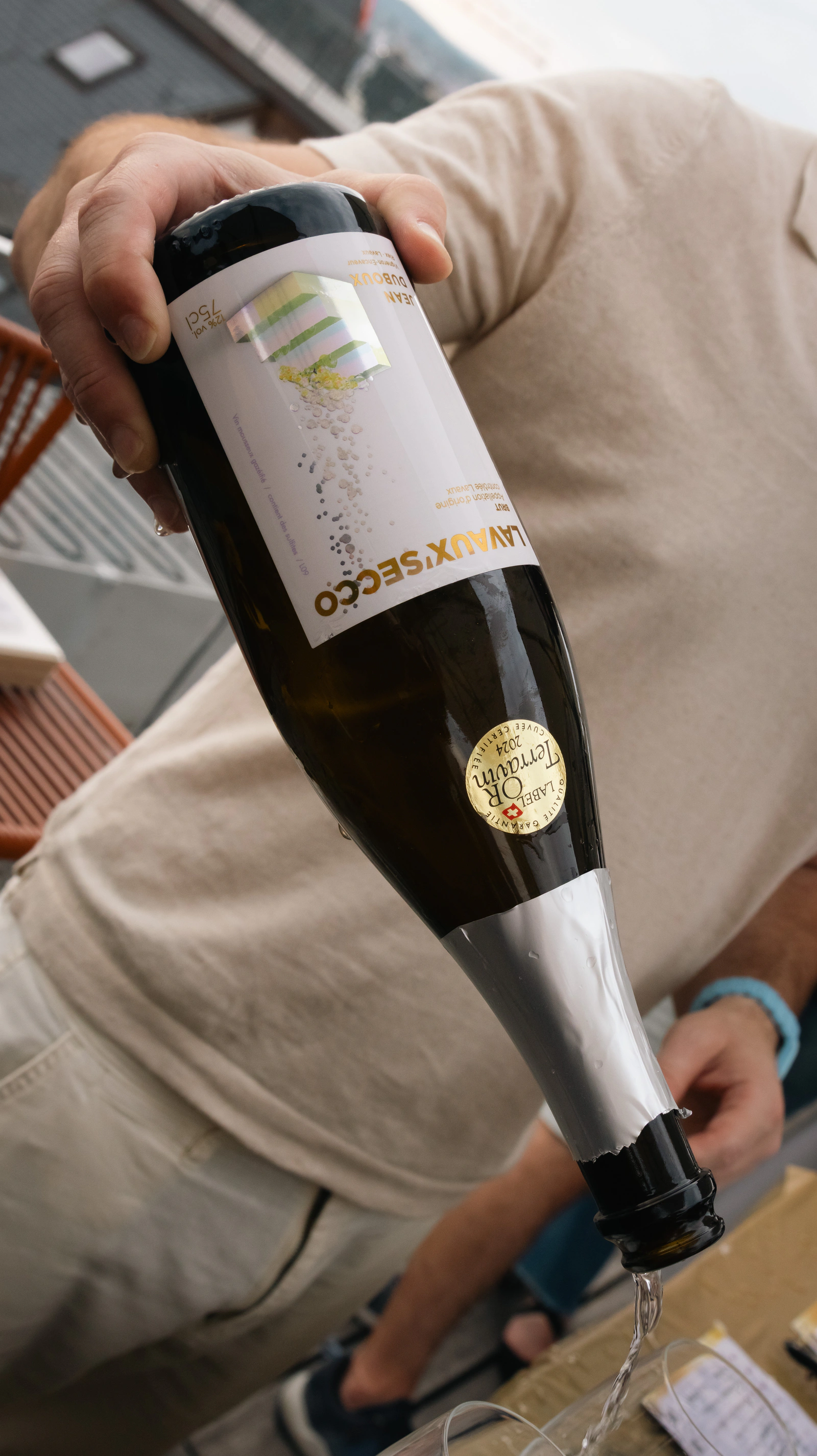 A bottle of prosecco being poured at the stand